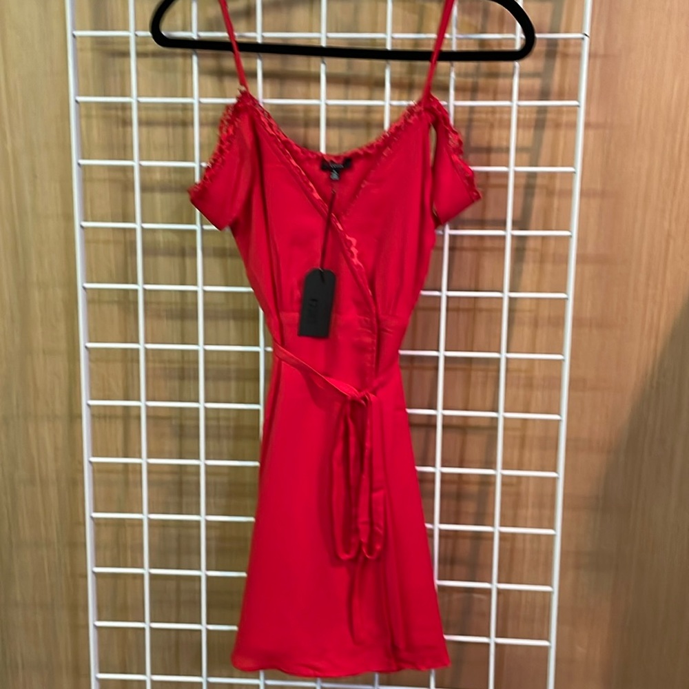 Luca red V-neck. Open shoulder with thin straps and frills, Size small. NWT